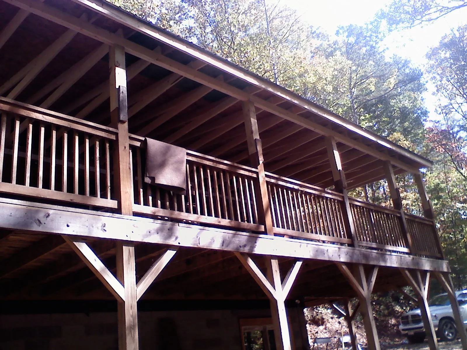 Timber framing under a new elevated porch and deck — Roof Leak Repair in Woodsville by Roofing Brothers